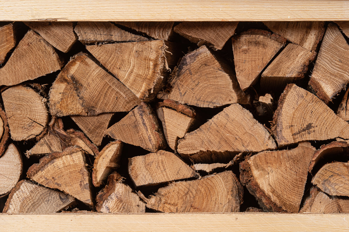 Close-up of oak logs in a crate